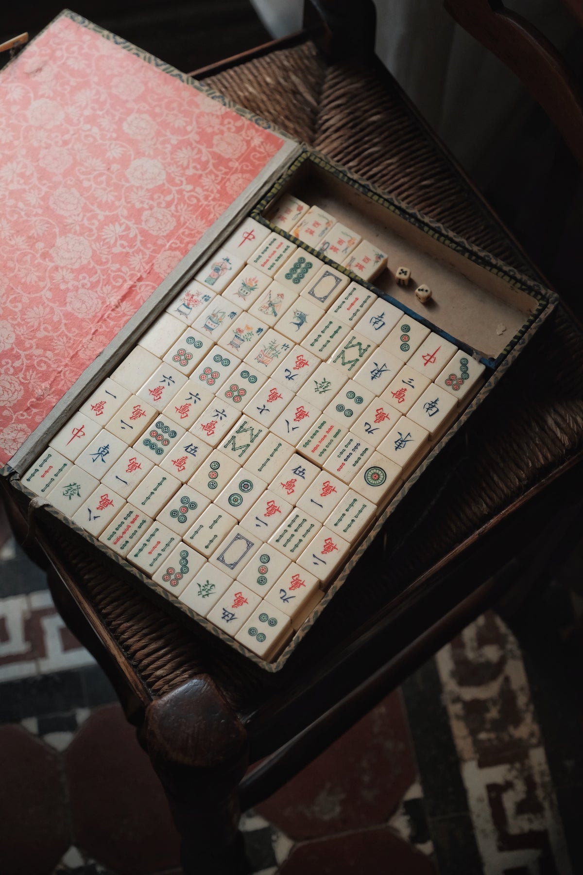 Vintage 1960s hand-carved bone-and-bamboo mahjong set with matching bone dice.