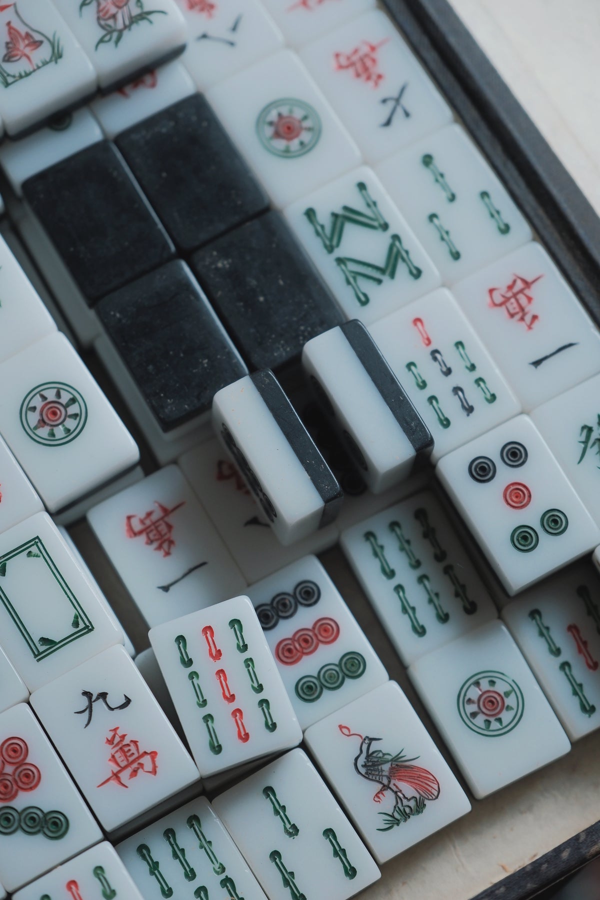 Vintage 1980s Hand-carved calligraphy style mahjong set with black backing