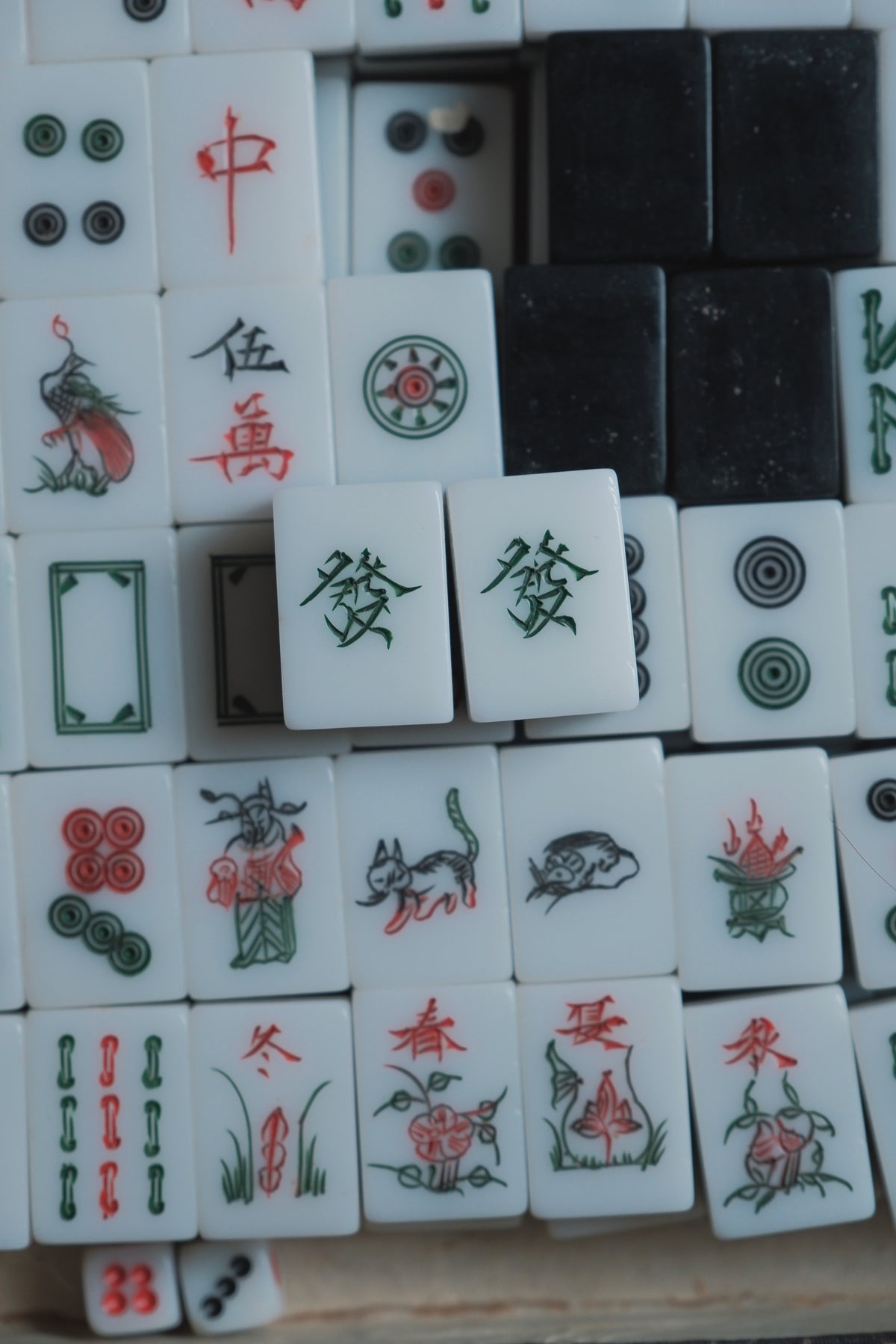 Vintage 1980s Hand-carved calligraphy style mahjong set with black backing