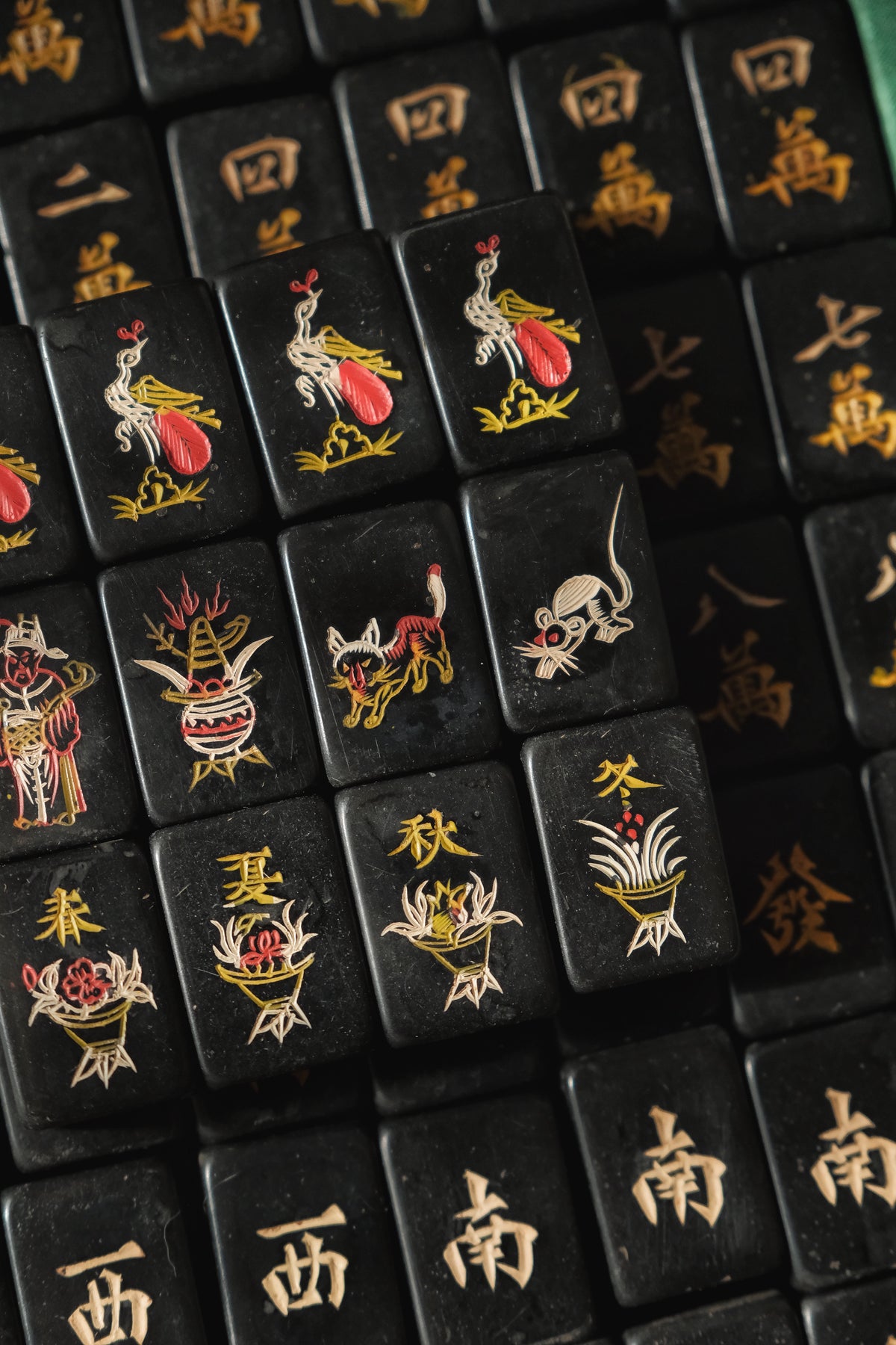 Vintage 1980s hand-carved Bakelite black mahjong set cat tiles.
