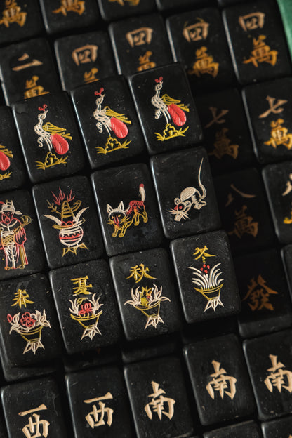 Vintage 1980s hand-carved Bakelite black mahjong set cat tiles.