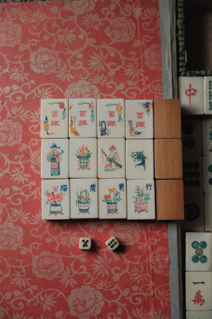 Vintage 1960s hand-carved bone-and-bamboo mahjong set with matching bone dice.