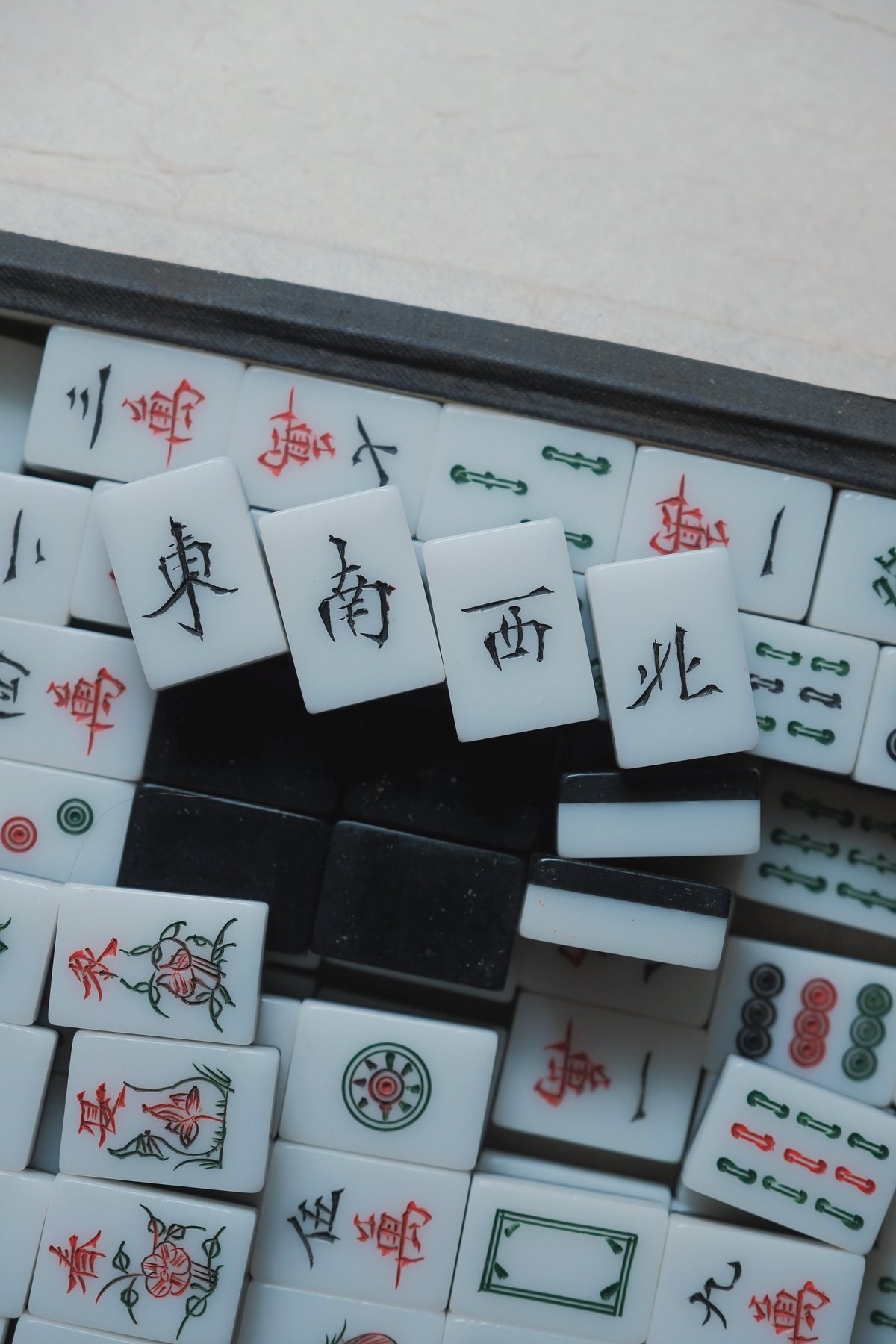 Vintage 1980s Hand-carved calligraphy style mahjong set with black backing