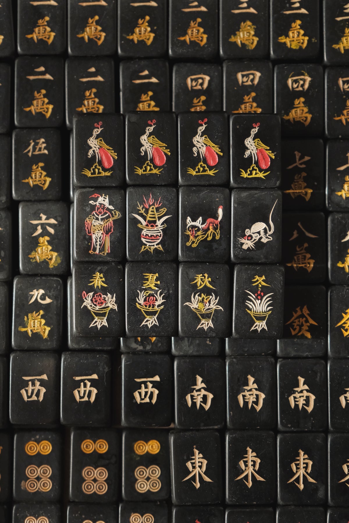 Vintage 1980s hand-carved Bakelite black mahjong set cat tiles.