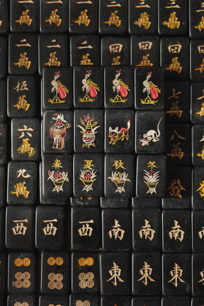 Vintage 1980s hand-carved Bakelite black mahjong set cat tiles.