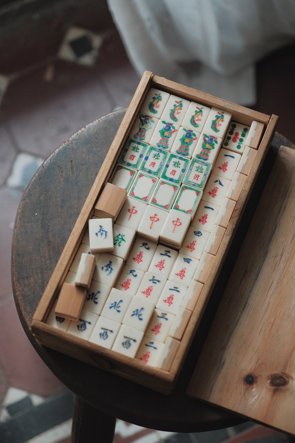 Vintage 1970s Bamboo-Backed Hand-Carved Sichuan style figure tile mahjong set.