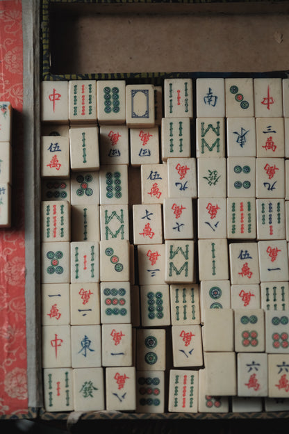 Vintage 1960s hand-carved bone-and-bamboo mahjong set with matching bone dice.
