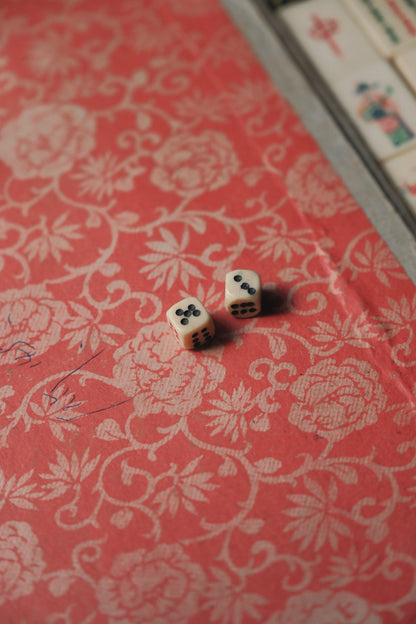 Vintage 1960s hand-carved bone-and-bamboo mahjong set with matching bone dice.