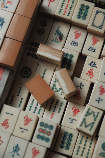 Vintage 1960s hand-carved bone-and-bamboo mahjong set with matching bone dice.