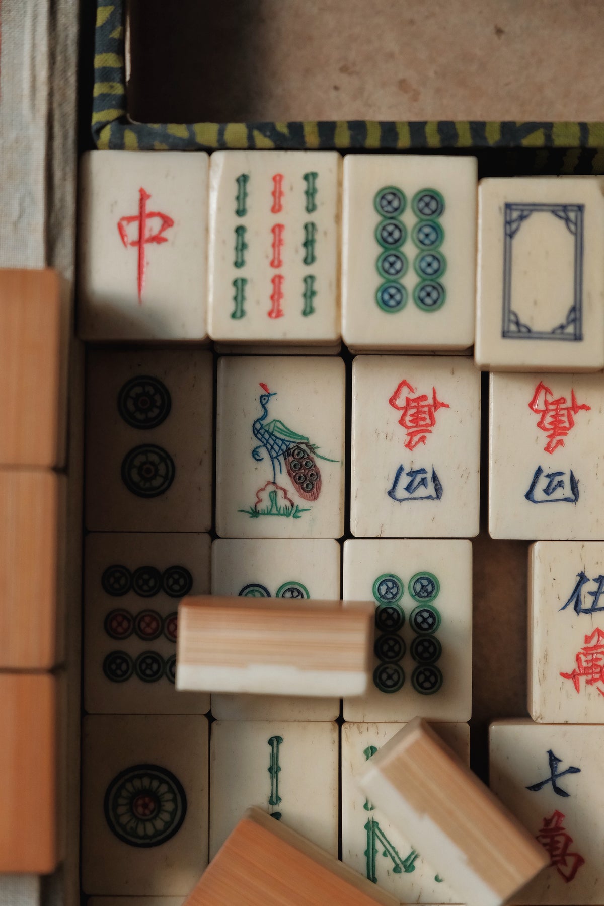 Vintage 1960s hand-carved bone-and-bamboo mahjong set with matching bone dice.