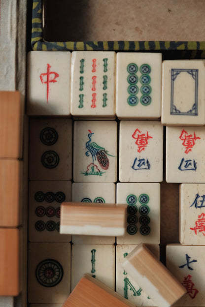 Vintage 1960s hand-carved bone-and-bamboo mahjong set with matching bone dice.