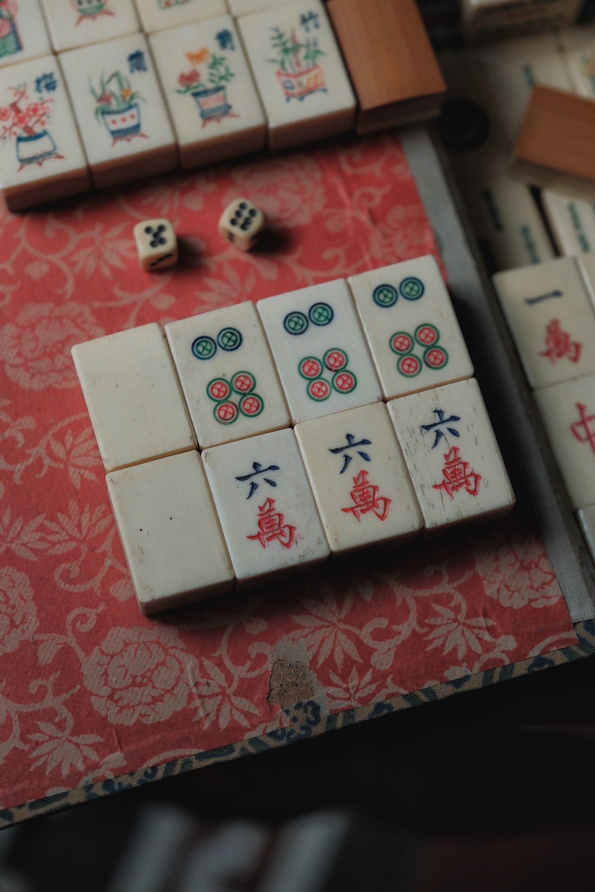 Vintage 1960s hand-carved bone-and-bamboo mahjong set with matching bone dice.