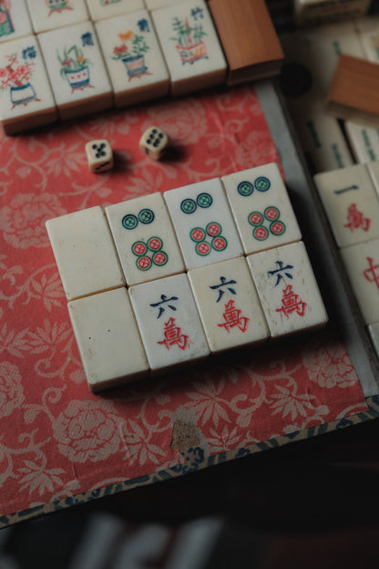 Vintage 1960s hand-carved bone-and-bamboo mahjong set with matching bone dice.